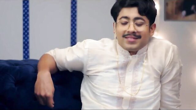 Handsome Indian man in white kurta smiles seductively, Beer Boys Vodka Girls web series