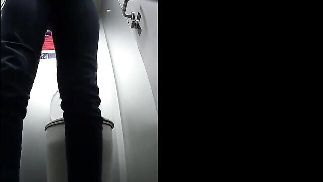 Voyeur of cleanly shaven girl pissing in train toilet