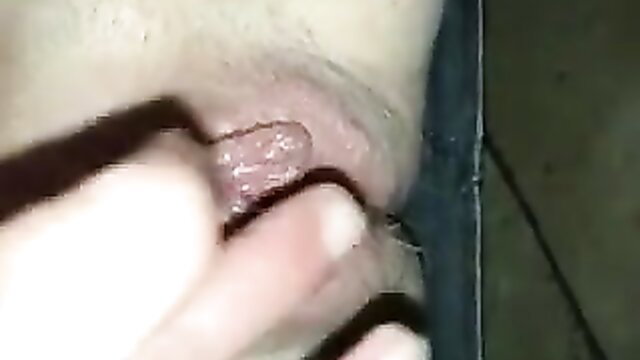 Closeup of woman spreading big pink pussy lips with fingers