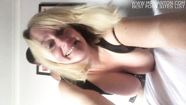 Big tits blonde smiling in black tank top cleavage selfie