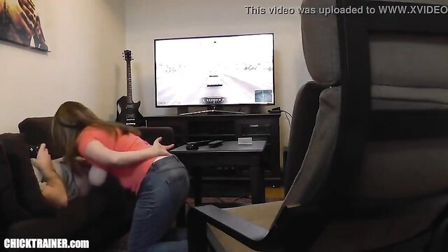 Britney Swallows sucks off gamer on Xbox with huge swinging tits