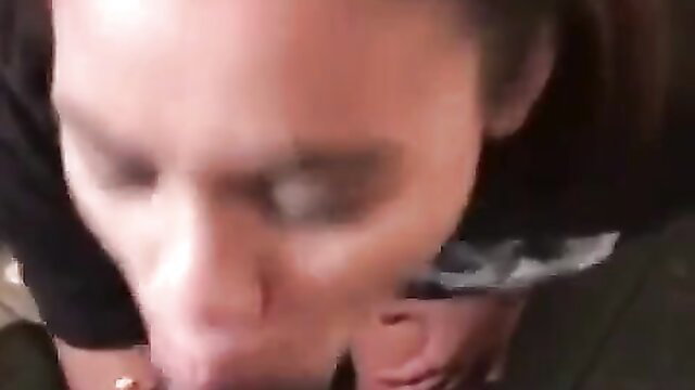 Closeup of woman with dark hair sucking cock POV in bathroom