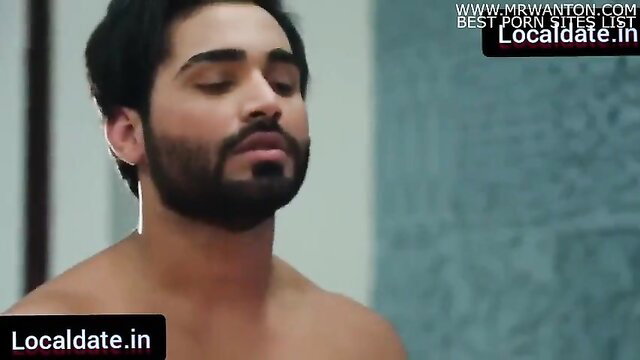 Handsome bearded Indian man bare chest eyes closed in steamy adult scene