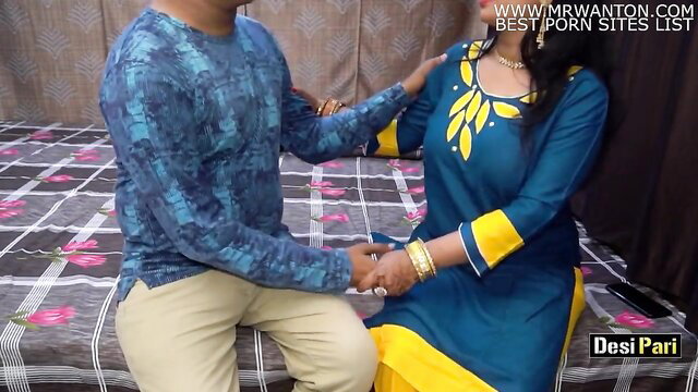 Desi Pari Aunty in blue saree holding hands with man on bed