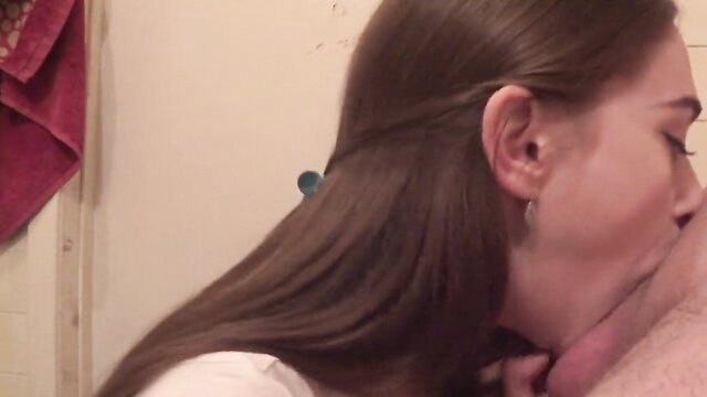 Brunette amateur babe with long tongue kisses hard cock close-up