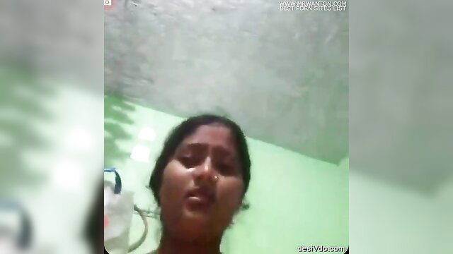 Indian amateur babe closeup face in bathroom, wet lips and dark hair