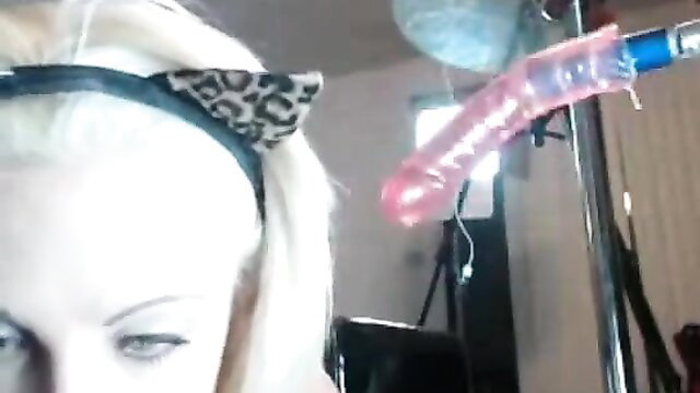 Holly Hanna blonde with cat ears holds pink dildo deepthroat toy