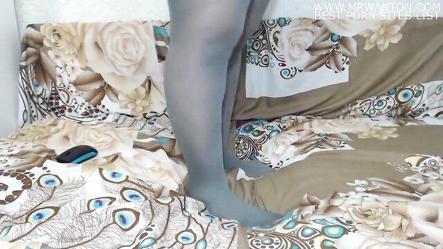 Big fat ass in tight gray leggings teasing on bed