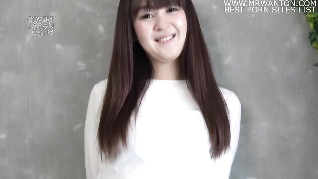 Smiling sexy Asian MILF Akane in white dress long black hair
