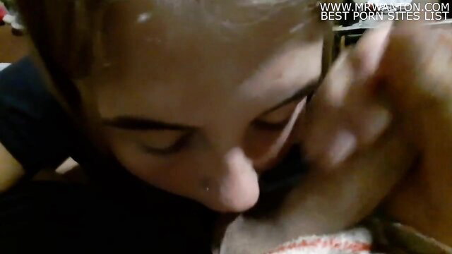 Closeup girl licking balls and slurping cum off them