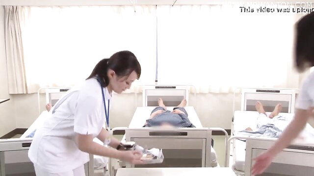 Japanese nurses caring for elderly male patients in JAV hospital scene
