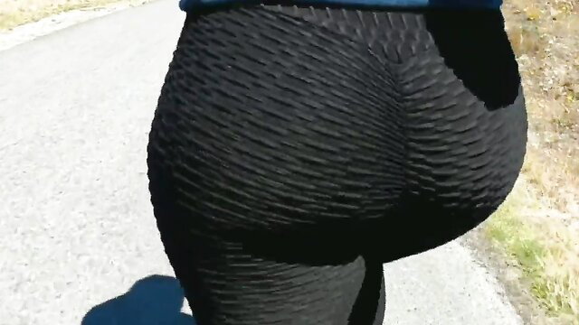 Mom's big ass wedgie in tight black leggings outdoors