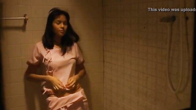 Thai nurse in pink uniform collapsed in shower, sexy pose