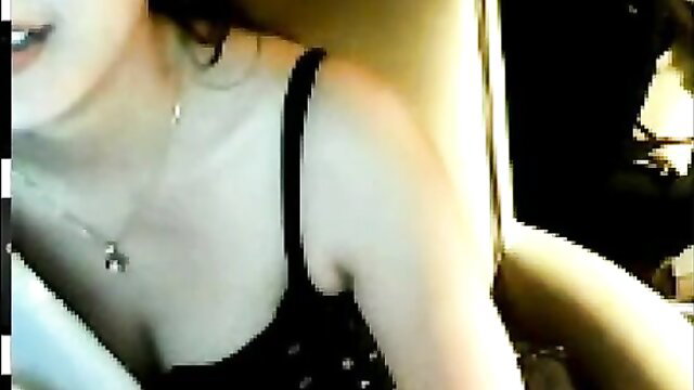 Stunning Asian beauty in black tank top with deep cleavage closeup