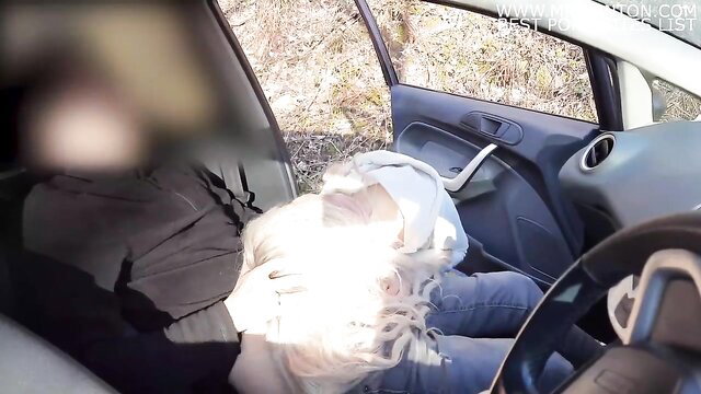 Blonde runner girl bends into car to help guy jerk off in public park