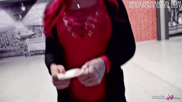 Redhead teen Cloe holds card at street casting pickup in Berlin