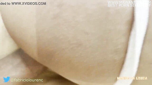 Closeup of woman's pale thighs in white panties asleep, cum on face