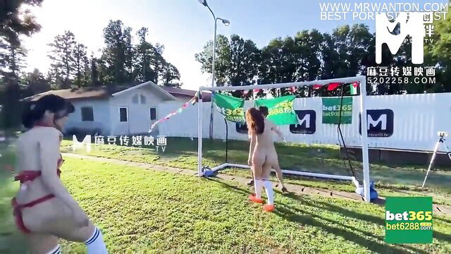 Nude Asian babes in sexy soccer outfits play naked football outdoors