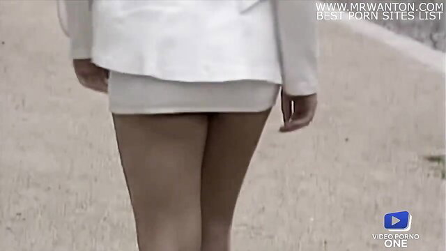 Dolly Golden in mini skirt walking away, hot legs & ass view