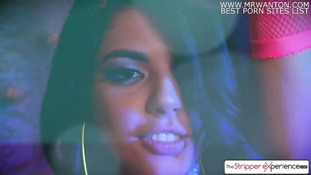 Gina Valentina smiles sexy at strip club in neon lights