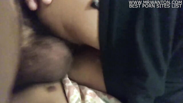 Latina woman passionately kissing neck in intimate closeup