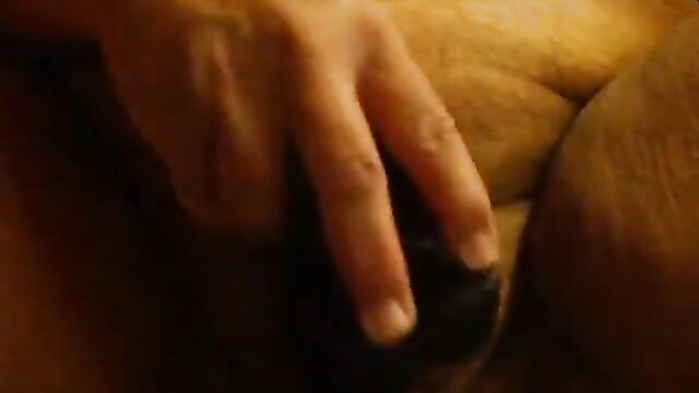 Woman's big ass fucked hard with thick black dildo closeup