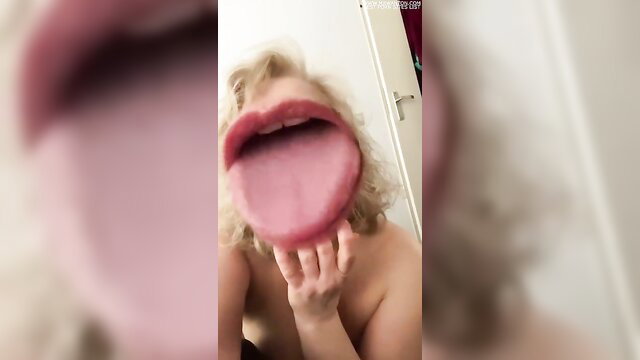 Blonde Carina sticks out huge wet tongue in teasing morning closeup