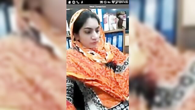 Pakistani office girl in orange hijab dupatta on video call