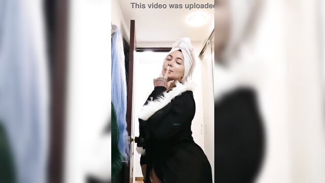 Arab woman in fur coat shushing, BussIt Challenge tease
