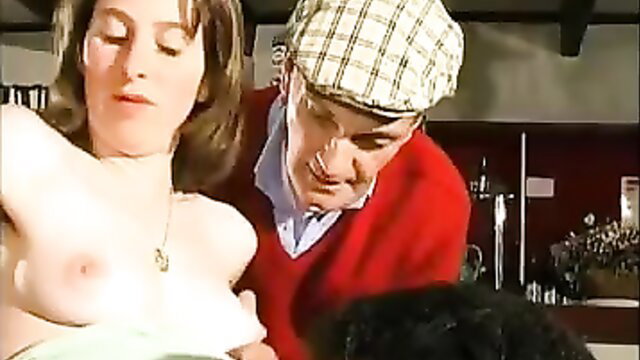 Old man groping brunette's tits in kitchen scene