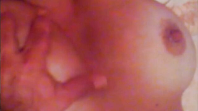 Closeup of Greek girl's pink erect nipples and big natural tits