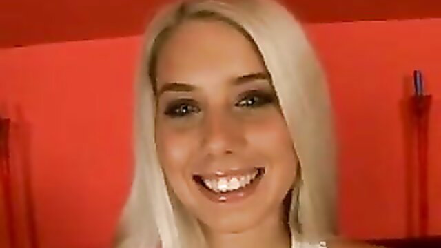 Blonde pornstar Nesty smiles seductively in hot adult video thumbnail