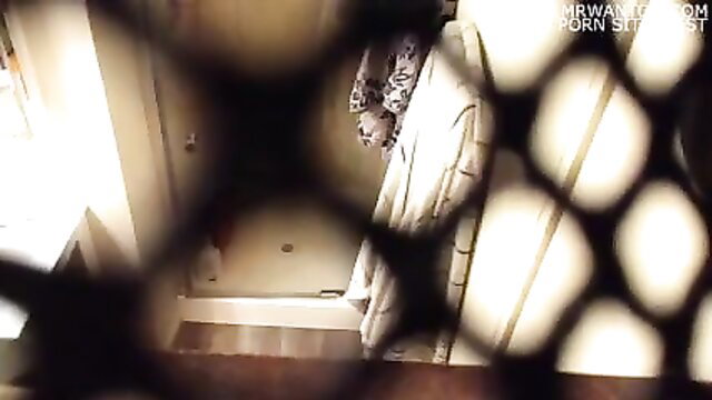 Hidden cam of woman masturbating in shower behind curtain