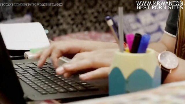 Indian girl typing on laptop in bedroom, hot web series scene