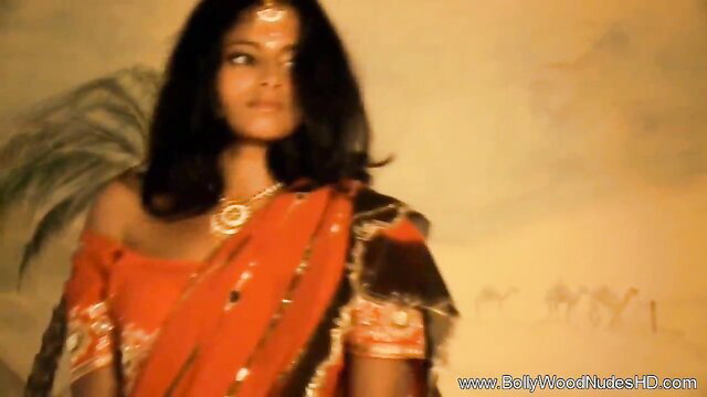 Oriental Indian beauty in orange saree showing cleavage, Bollywood Nudes HD