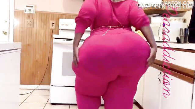 Thick BBW in tight pink tracksuit shakes huge black ass in kitchen JOI