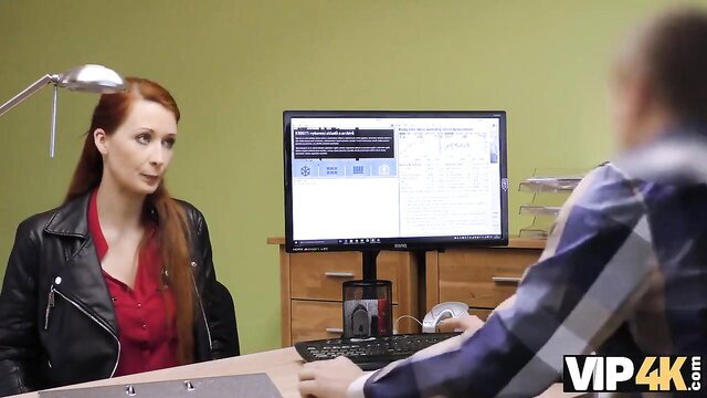 Redhead Isabela in leather jacket seduces man at desk VIP4K
