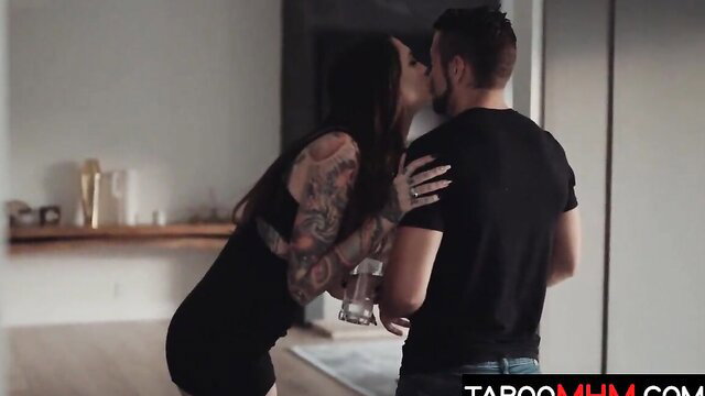 Tattooed stepsister in tight black dress kisses guy passionately