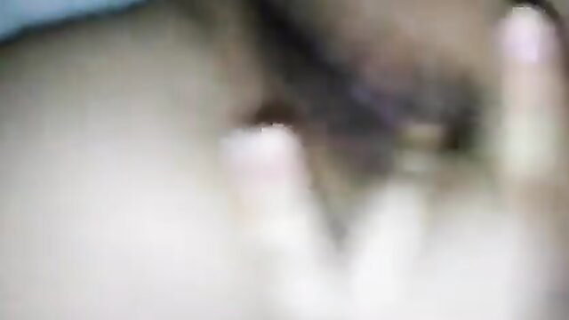 Blurry closeup of woman masturbating fingers in pussy at night