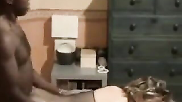 Muscular black man groping pregnant white woman's pussy on bed