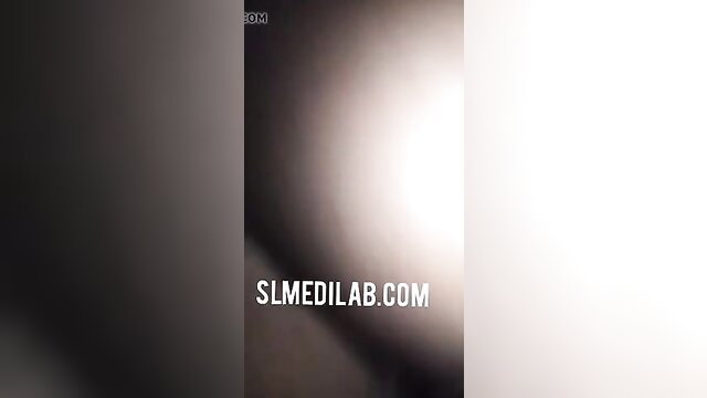 Mystery Asian woman in gradient light glow, erotic tease