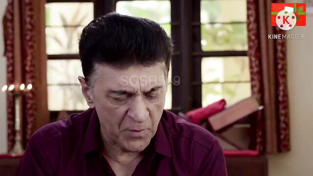 Mature Indian man in purple shirt, intense expression, desi bold scene