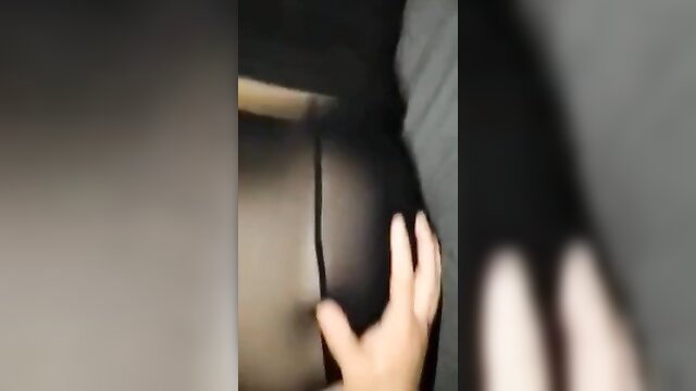 Hot babe in black pantyhose gets groped by hand on big ass closeup