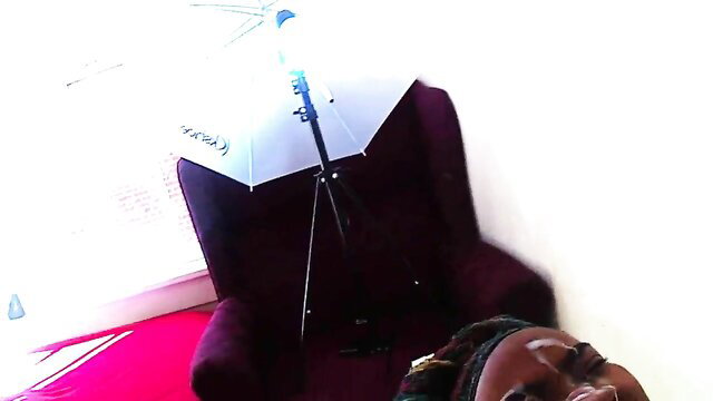 Ebony woman with glasses on purple chair in cum facial compilation