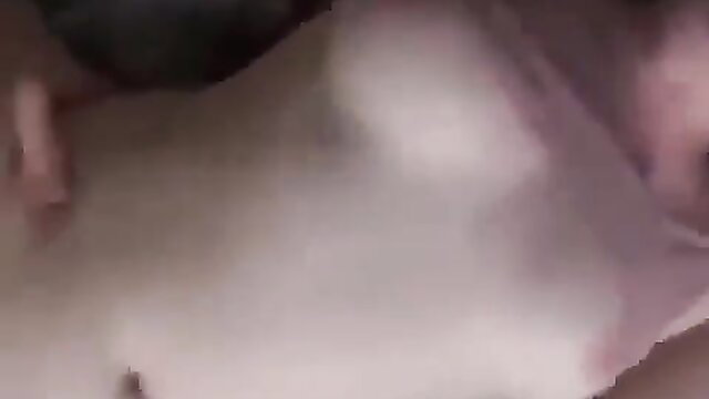 Arab woman in white lingerie exposing huge tits closeup