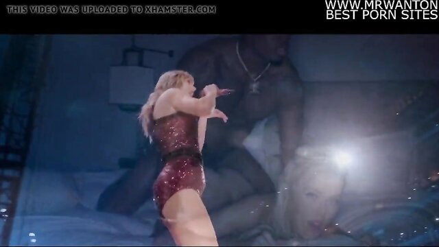 Taylor Swift in red sparkly bodysuit performing on stage BBC PMV