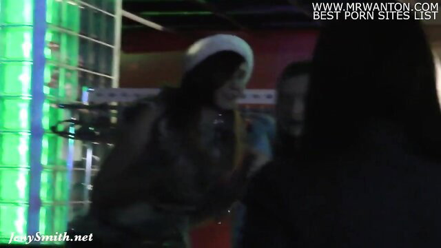 Asian babe in white beret flashing tinsel-only at neon club public tease