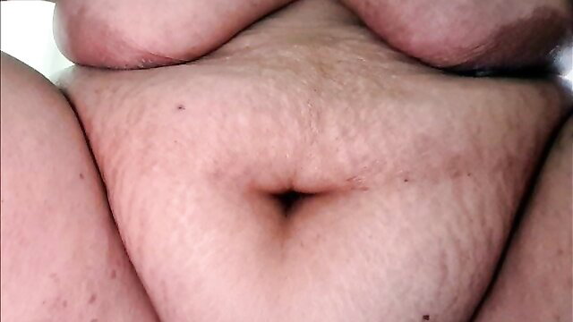 Beate spreads thick thighs exposing hairy pussy closeup