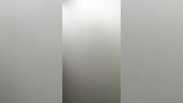 Blurry closeup of floppy tits in revealing top, teasing adult preview