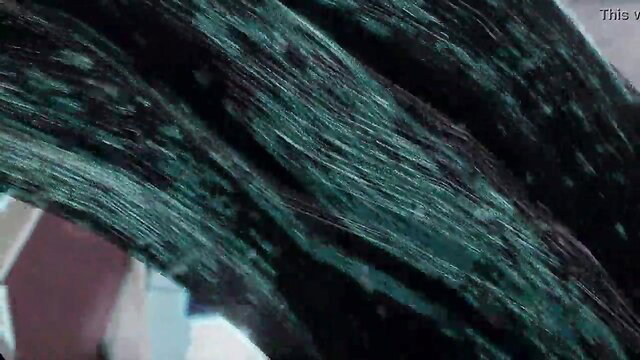 Closeup of glistening green feline fur strands in erotic tease